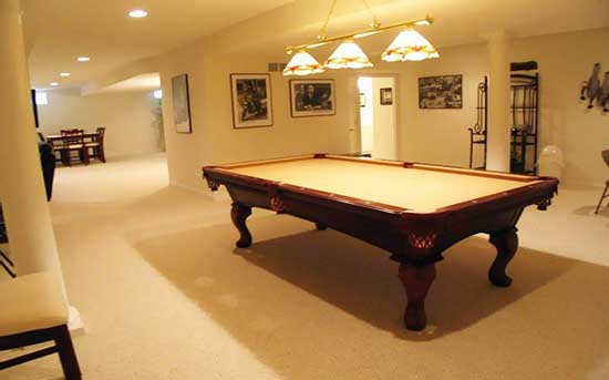 Basement Remodel - Photo of a pool table in a professionally designed basement by Tamer Construction.