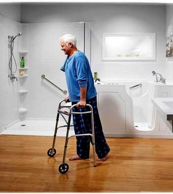 ADA Compliant Bathroom - Photo of an older man with walker in a handicap accessible bathroom remodel. 